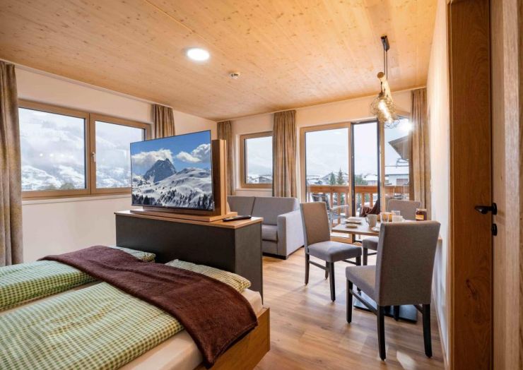 202426234728482-mm-appartements-schulgasse-14-westendorf-appartement-1-klein-wohnraum-bett